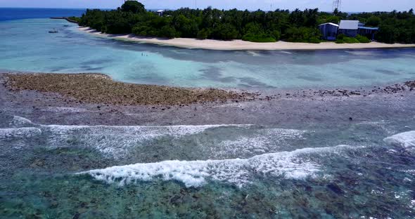 Beautiful overhead island view of a paradise sunny white sand beach and turquoise sea background