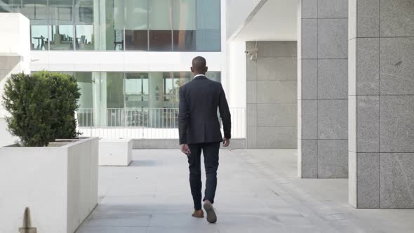 African American Businessman Wearing Suit, Walking Outdoors