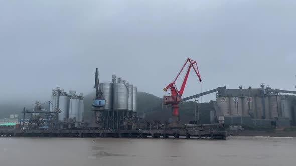 cement factory on the coast in the rain.