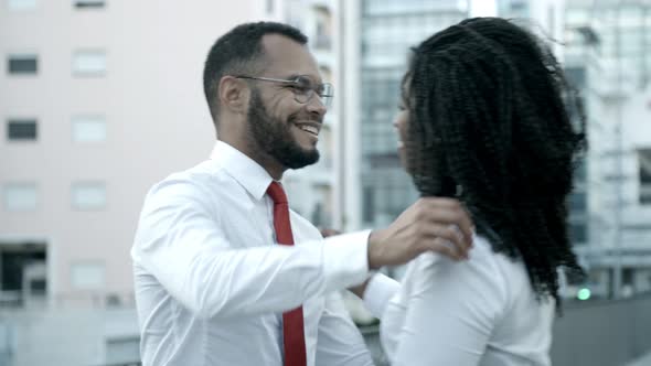 Slow Motion Shot of Two Friends Hugging on Street.