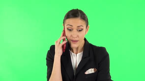 Woman Speaking Via Telephone Looking Boredon. Green Screen