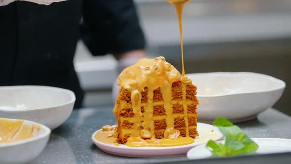Pouring a Sweet Sauce on Honey Cake