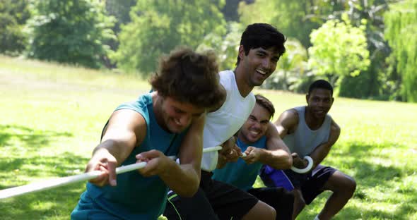 Men pulling a rope in a tug of war