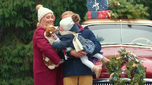 Family on the Background of a Retro Car