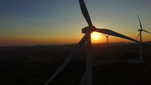 Flying close to windmill blades at dusk