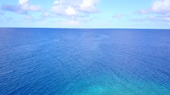 Aerial drone sky of marine shore beach trip by blue ocean and sand background