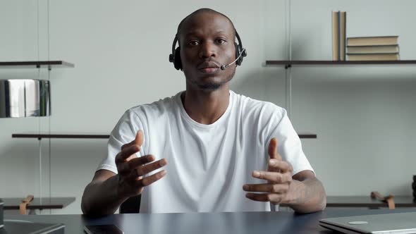 Black Businessman is Talking to a Webcam on a Conference Call