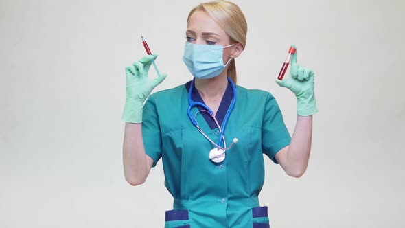 Doctor Nurse Woman Wearing Protective Mask and Latex Gloves - Holding Blood Test Tube and Syringe