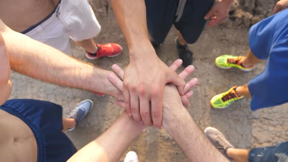 Many Male Hands Getting Together. Team of Athletes Putting Arms Together Outdoor. Group of People