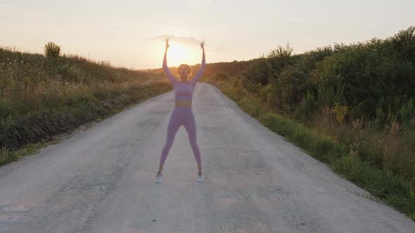 Girl Does the Exercises on the Openair