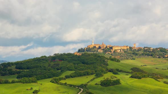 Time lapse of clouds over town of Pienza in Tuscany Italy