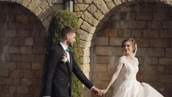 Newlyweds. Caucasian Groom with Bride in the Park. Wedding Couple. Happy Family