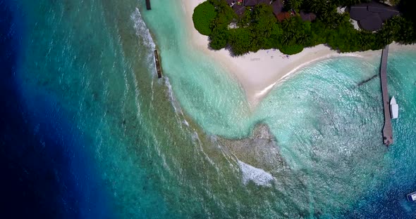 Daytime drone island view of a white sandy paradise beach and aqua turquoise water background in hi 