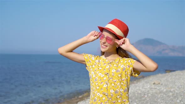 Cute Little Girl at Beach During Summer Vacation