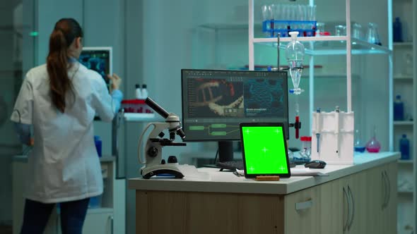 Tablet with Green Chroma Key Screen Placed on Desk in Lab