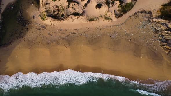 Deserted polluted beach, north of Vinh hy, Vietnam. Aerial static, birdseye