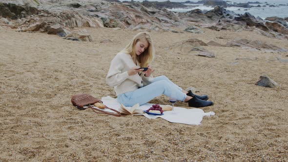 Woman Blogger Takes Photo of Picnic