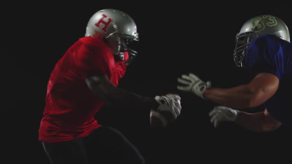 Two American football players in action