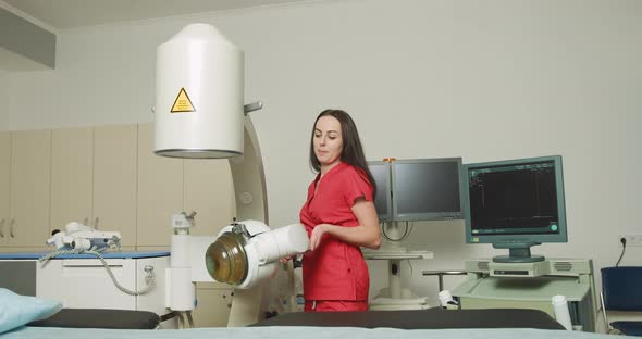 Portait of Pretty Confident Focused Caucasian Female Doctor Wearing Red Medical