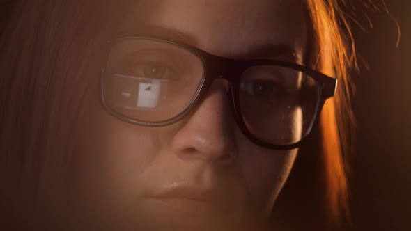 Close Up of Tired Woman Working at Night on Laptop Girl in Eye Glasses with Reflections Overworking