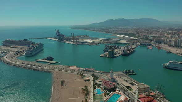 Aerial View. Malaga, Spain. City Buildings and Seaside View. Ships and Port.