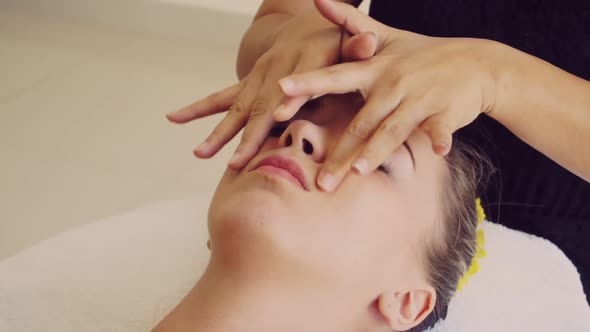 Woman Gets Facial and Head Massage in Luxury Spa