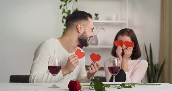 Couple Bearded Young Caucasian Man and Brunette Girl Sincerely Laughing Having Fun Together at Home