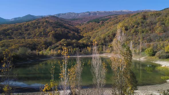 Lake With Autumn Forest And Mountains