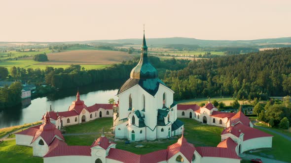 Moving Backwards Above the Pilgrimage Church of Saint John of Nepomuk on the Green Hill at Sunset