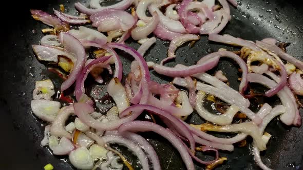 Preparation Chopped Fried Onion in Frying Pan in Domestic Kitchen for Cooking Food on Kitchen Stove