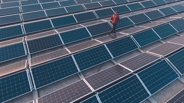 Man walks on the modern solar farm