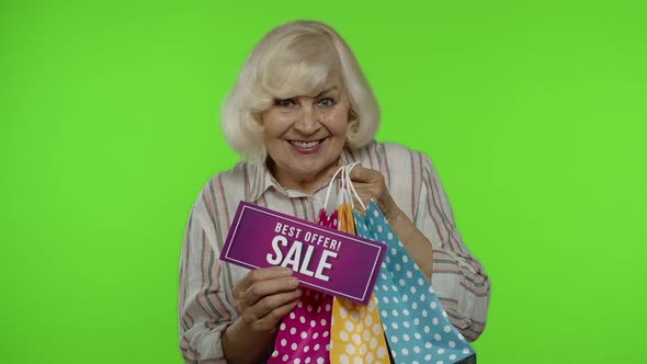 Senior Grandmother Showing Best Offer Sale Inscription From Shopping Bag, Rejoicing Good Discount