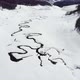 Amazing aerial view of a swirly river in the mountains during winter sunny day - VideoHive Item for Sale