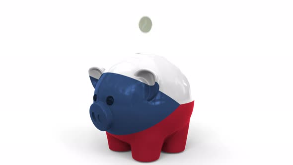 Coins Fall Into Piggy Bank Painted with Flag of the Czech Republic alt