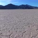 Flying low over cracked desert Racetrack Playa in Death Valley NP - VideoHive Item for Sale