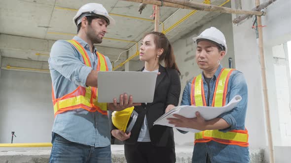 The engineering team working at building site meeting and discussing