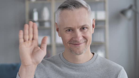 Hello, Gray Hair Man Waving Hand To Welcome