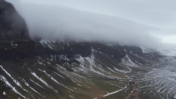 Aerial view of a river estuary along the mountain in Iceland.