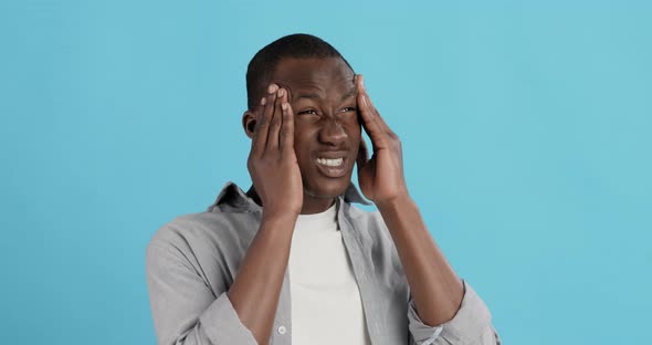 Black Guy Suffering From Headache Attack, Massaging His Head