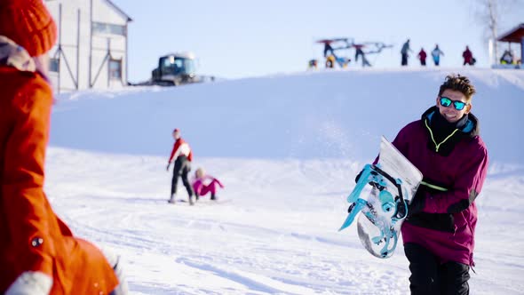 Happy Coulple Dating in Mountain Ski Resort at Sunny Day