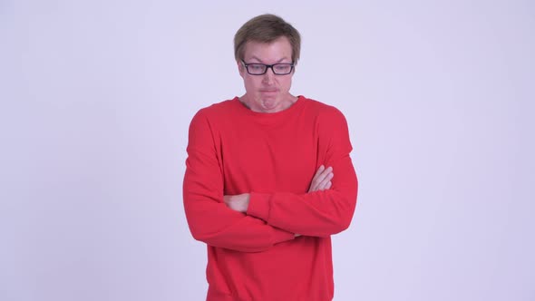 Stressed Young Man Looking Angry with Arms Crossed