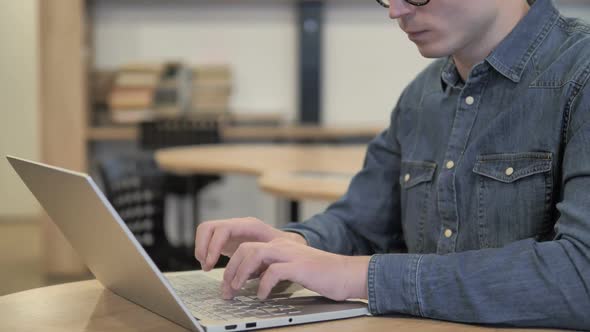 Headache Tense Creative Young Man Working on Laptop