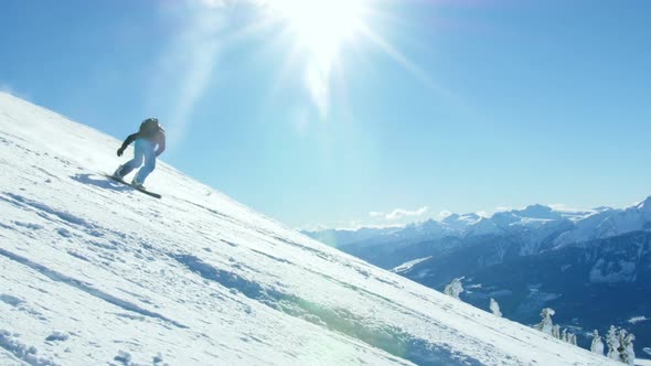 Person snowboarding on snowy mountain