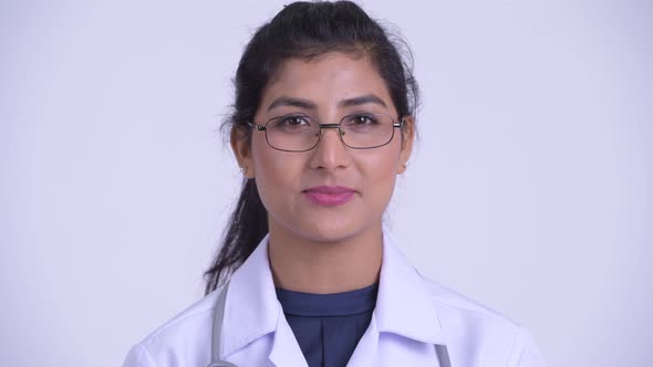 Face of Young Beautiful Persian Woman Doctor with Eyeglasses