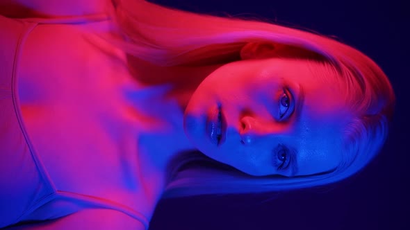 Portrait of a Beautiful Young Woman in Colored Light