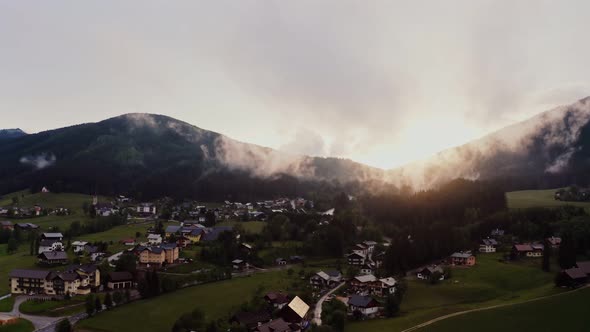 Panoramic View of a Picturesque Mountain Valley with a Village in a Lowland