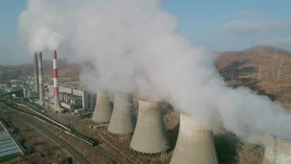 Aerial View of an Industrial Zone Pipes Pouring Thick White Smoke