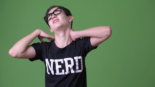 Young Handsome Iranian Teenage Boy Against Green Background