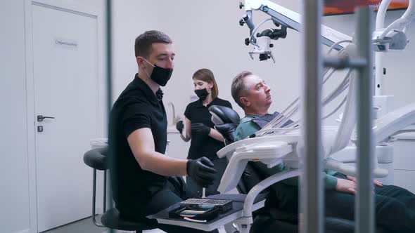 Dentist with Assistant Doing Surgery