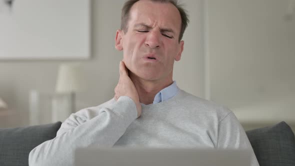 Portrait of Tired Middle Aged Businessman Having Neck Pain 